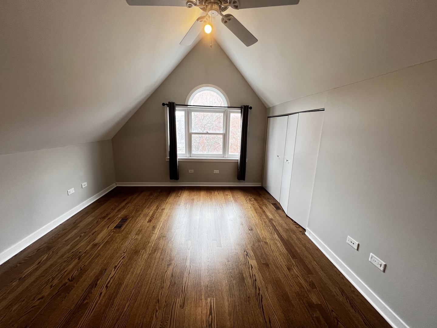 Undisclosed Address Chicago, IL 60657 - Photo 16 of 25 an empty room with wooden floor and windows