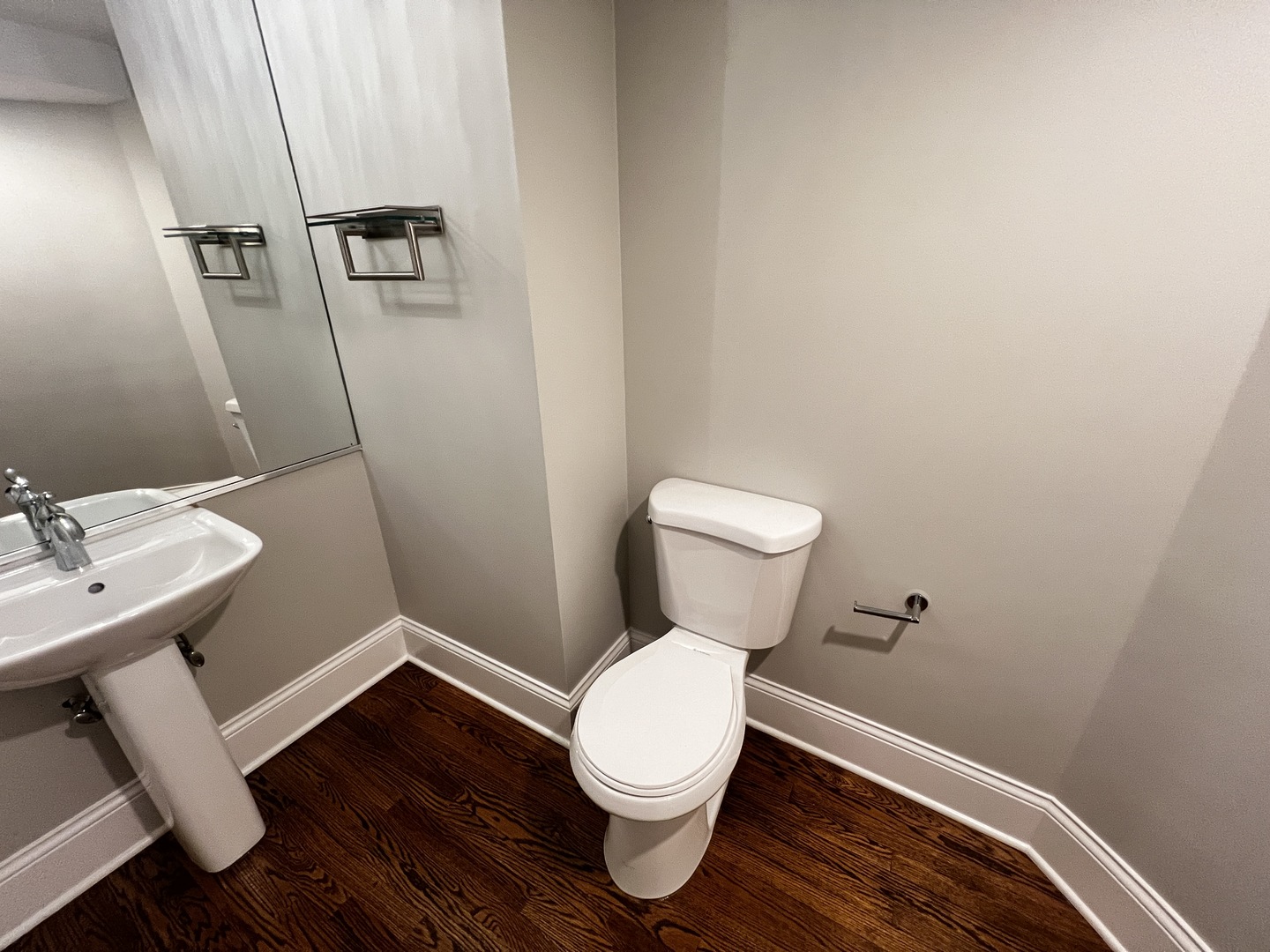 Undisclosed Address Chicago, IL 60657 - Photo 20 of 25 a white toilet sitting next to a bathroom sink