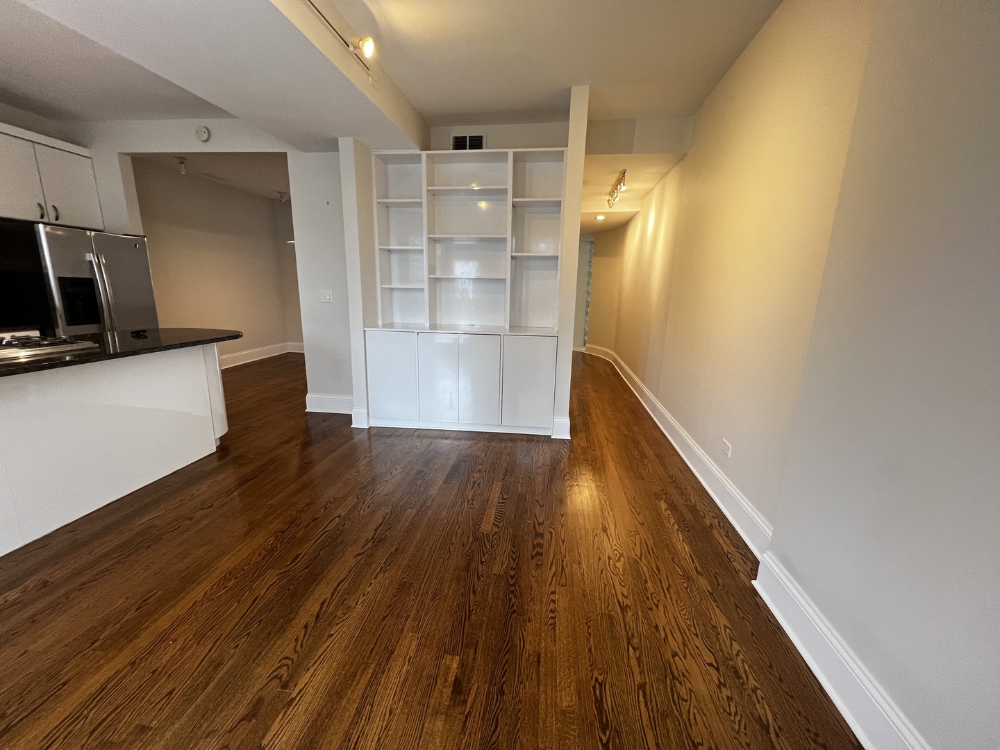 Undisclosed Address Chicago, IL 60657 - Photo 6 of 25 a view of empty room with wooden floor and fan