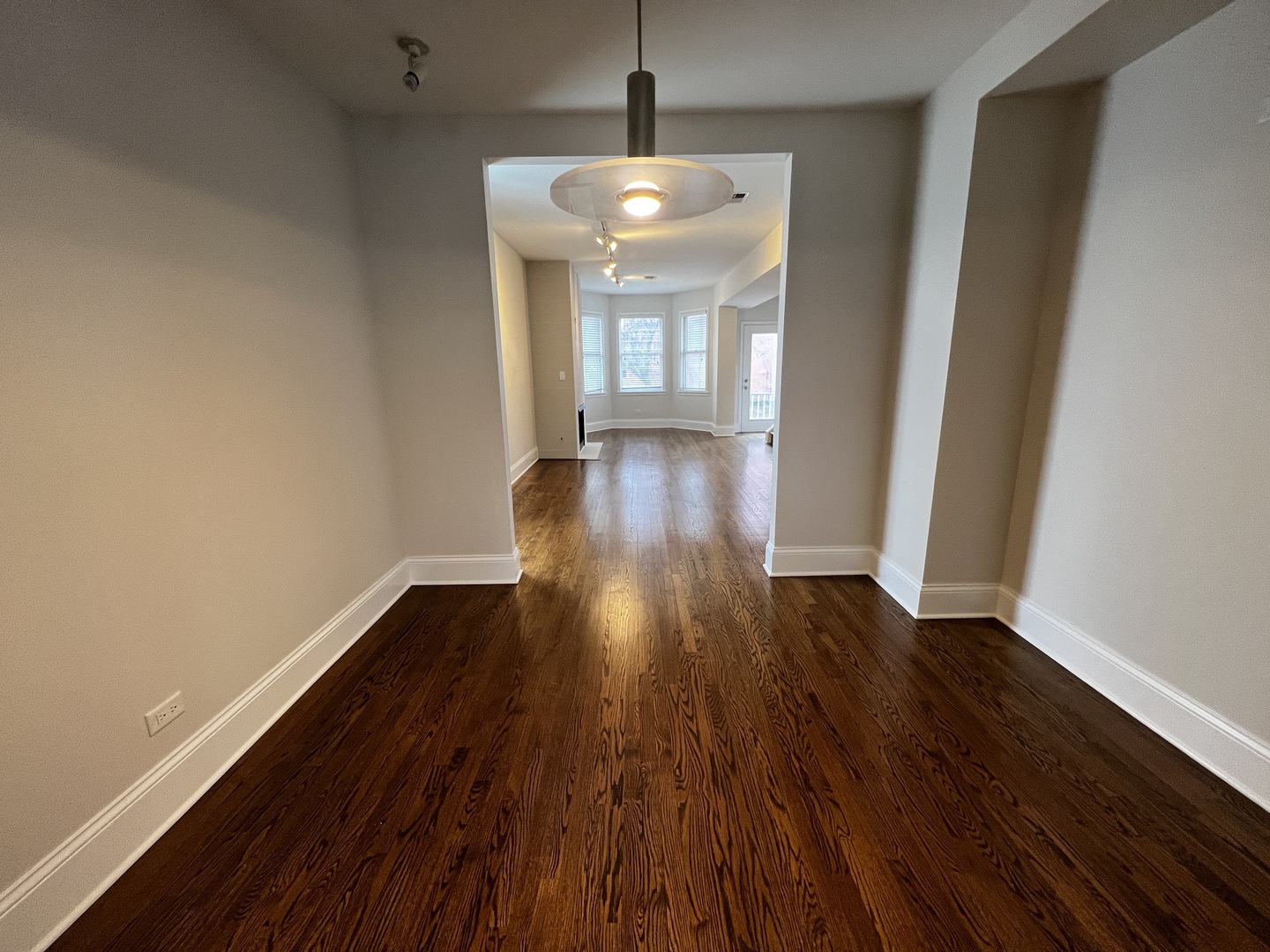 Undisclosed Address Chicago, IL 60657 - Photo 8 of 25 a view of empty room with wooden floor