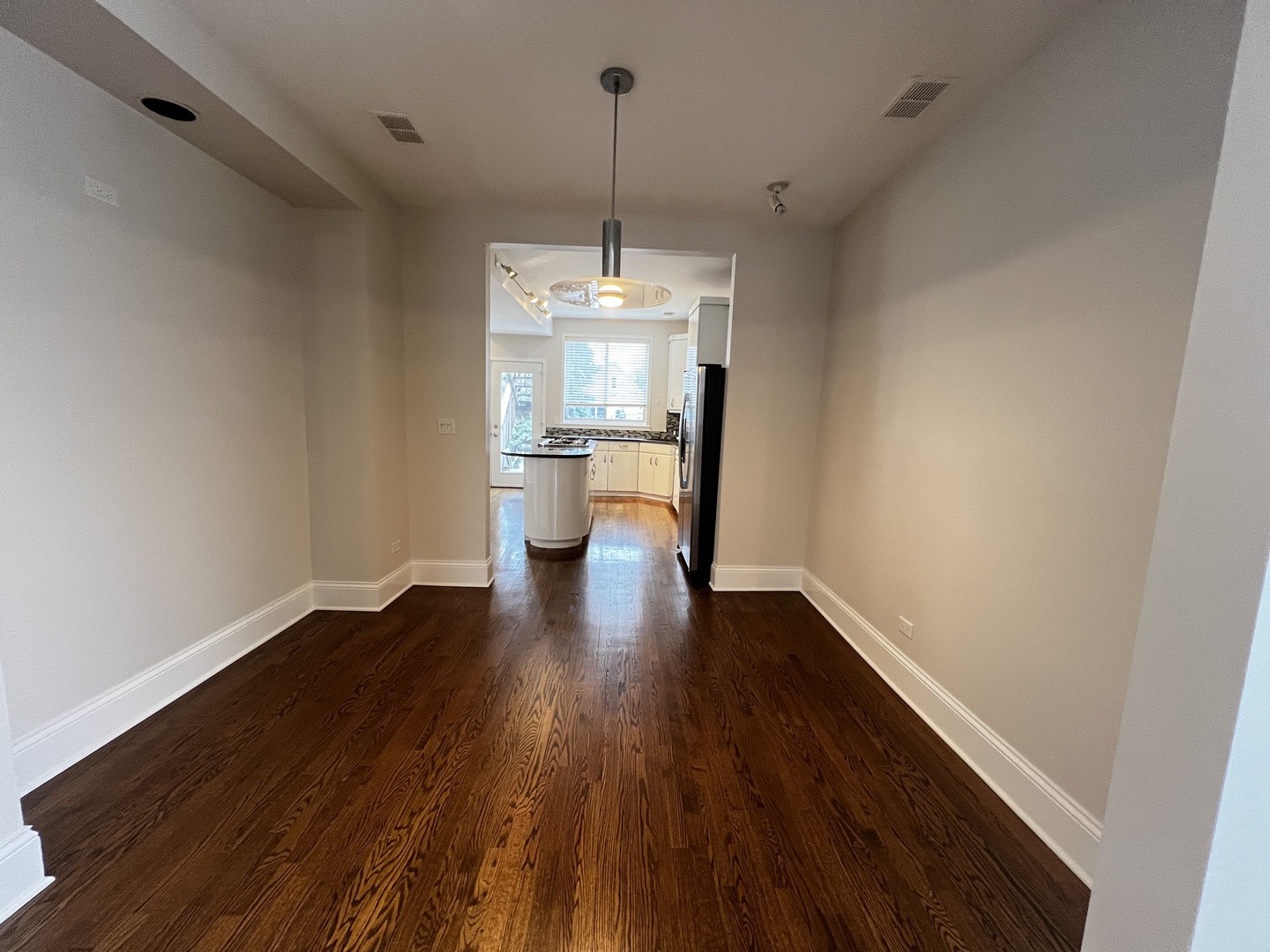 Undisclosed Address Chicago, IL 60657 - Photo 9 of 25 a view of a room with wooden floor and a window