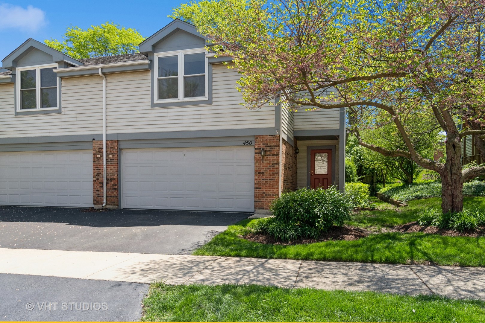 450 River Front Circle Naperville, IL 60540 - Photo 1 of 1 a front view of a house with a yard and garage