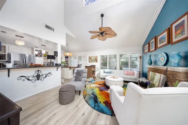 a view of a living room and kitchen area