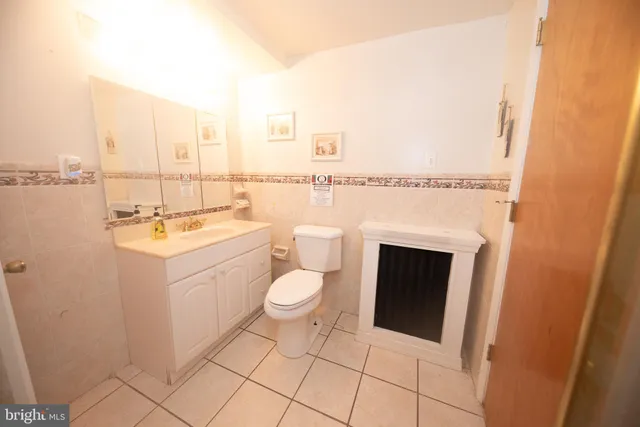 a bathroom with a sink toilet and tub