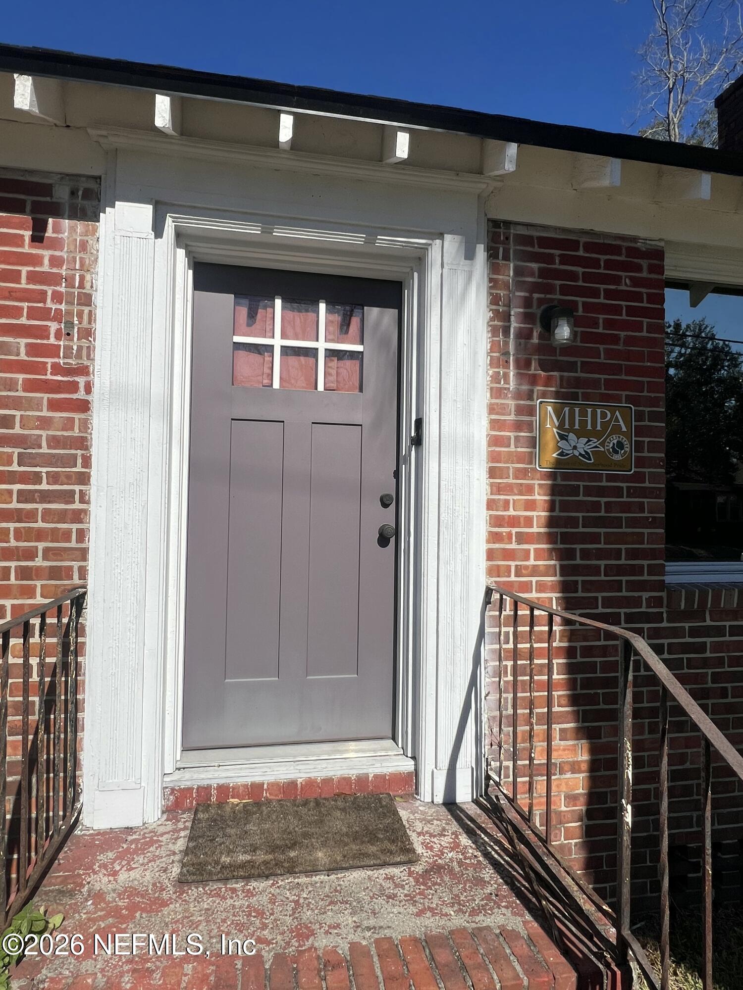 a view of a door and a window