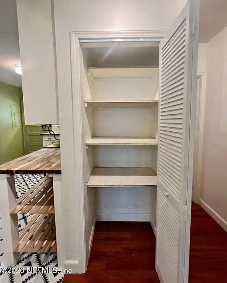 4659 Post Street Jacksonville, FL 32205 - Photo 14 of 24 a view of walk in closet with clothes and shoes