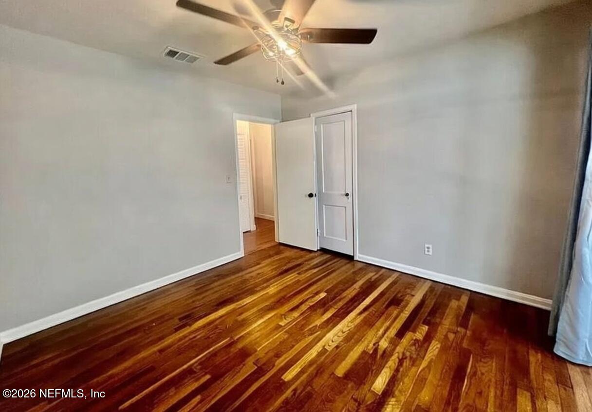 4659 Post Street Jacksonville, FL 32205 - Photo 17 of 24 a view of room with wooden floor and ceiling fan