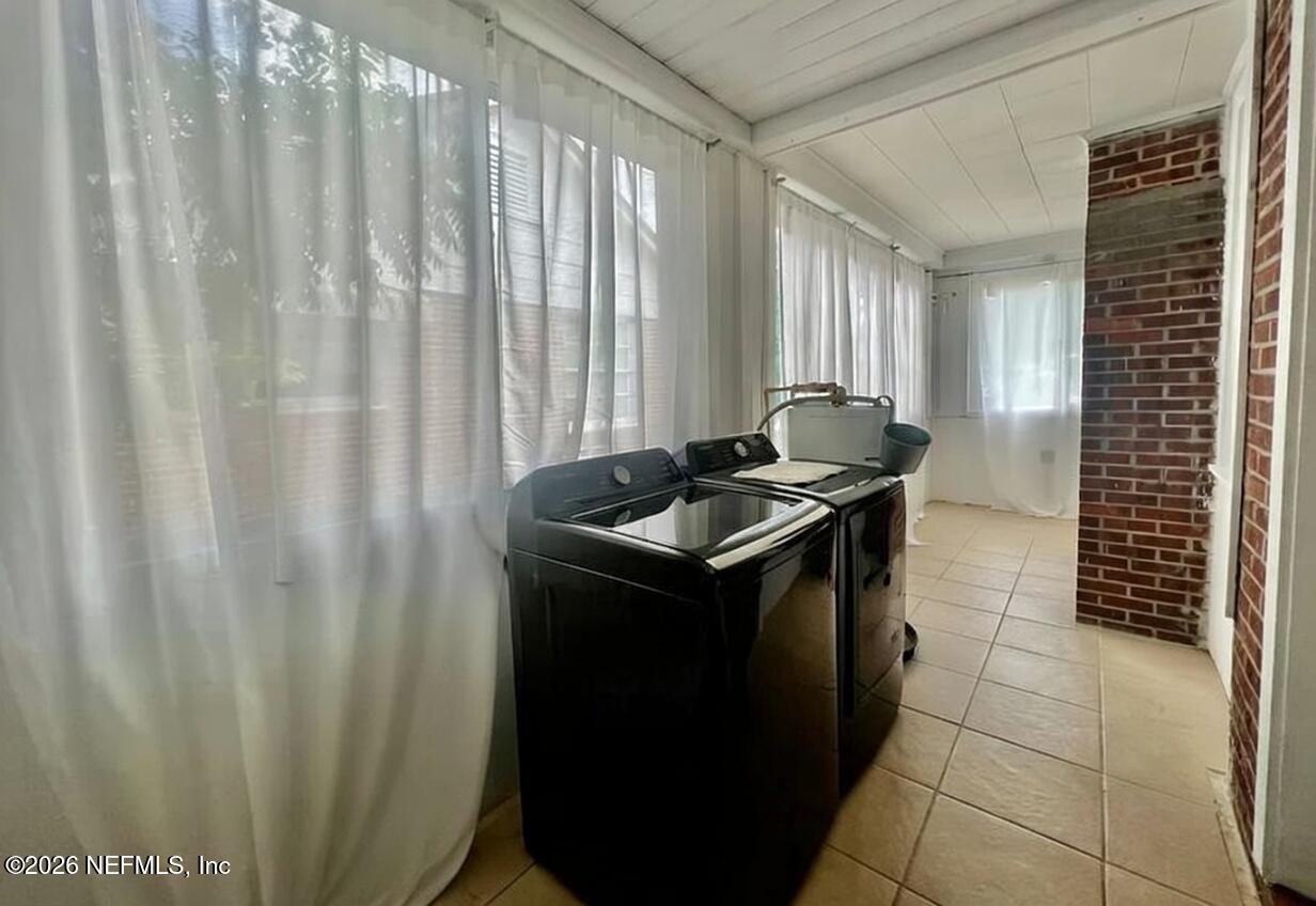 4659 Post Street Jacksonville, FL 32205 - Photo 20 of 24 a kitchen with a sink a stove and a shower curtain