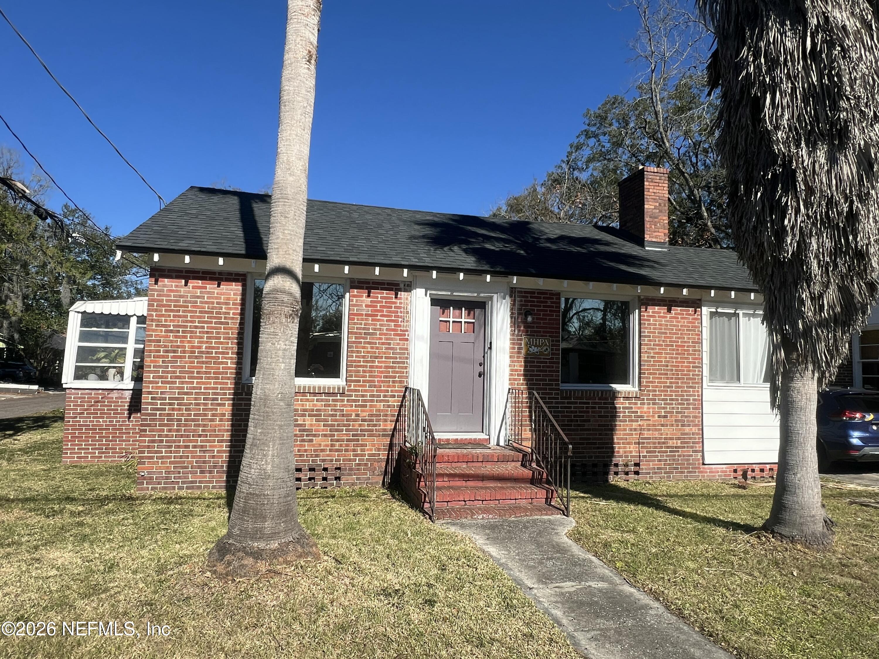 4659 Post Street Jacksonville, FL 32205 - Photo 2 of 24 a front view of a house with garden