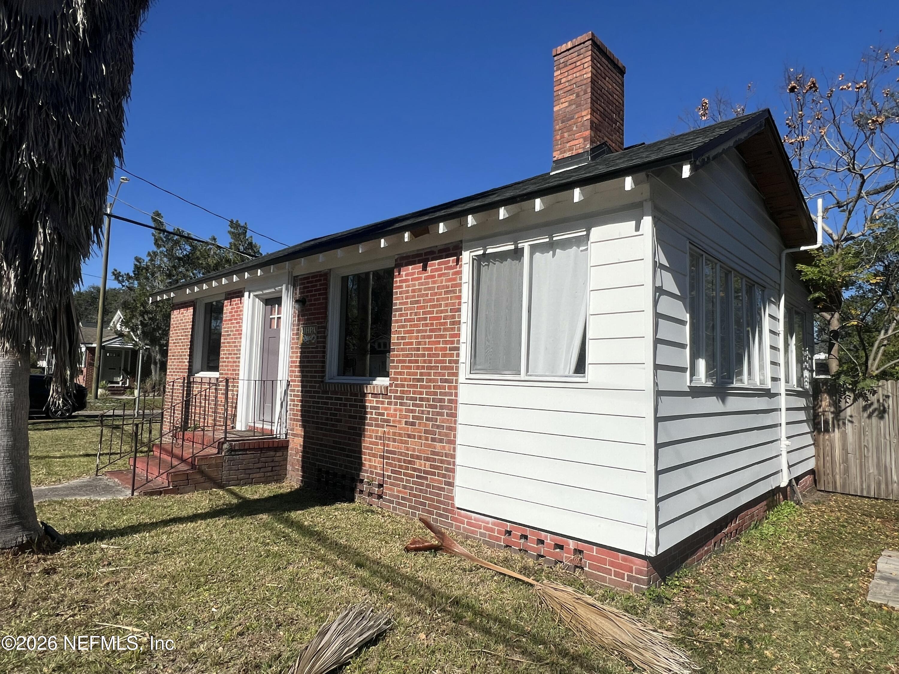 4659 Post Street Jacksonville, FL 32205 - Photo 3 of 24 a view of a house with a yard