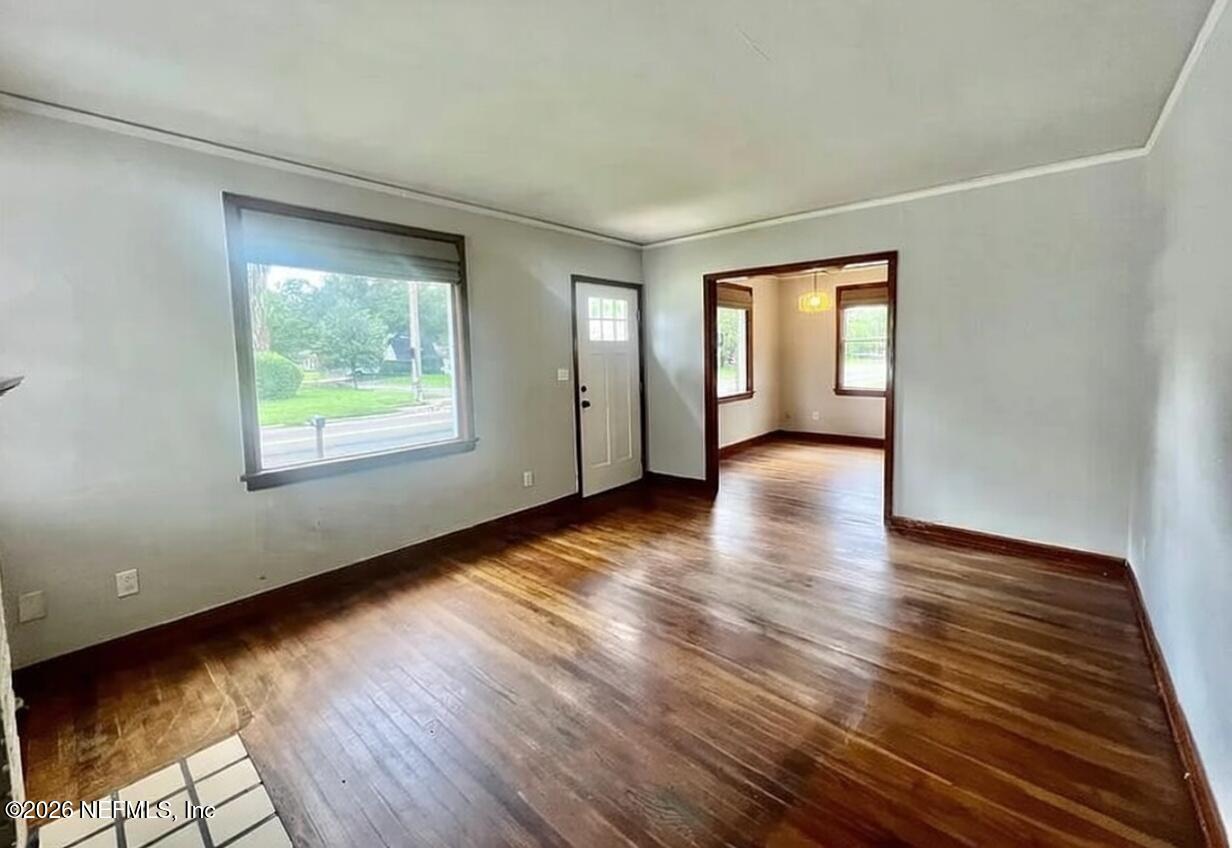 4659 Post Street Jacksonville, FL 32205 - Photo 9 of 24 an empty room with wooden floor and windows