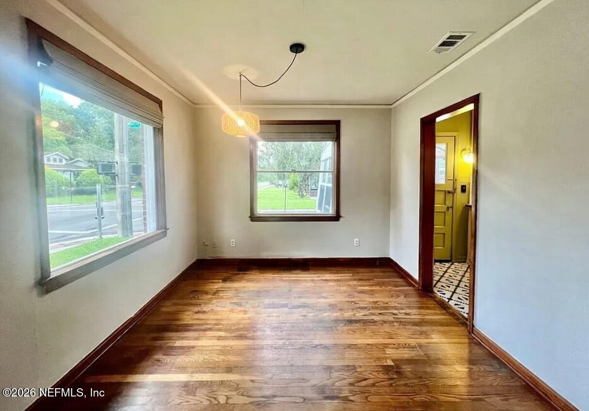 4659 Post Street Jacksonville, FL 32205 - Photo 10 of 24 a view of an empty room with window and wooden floor