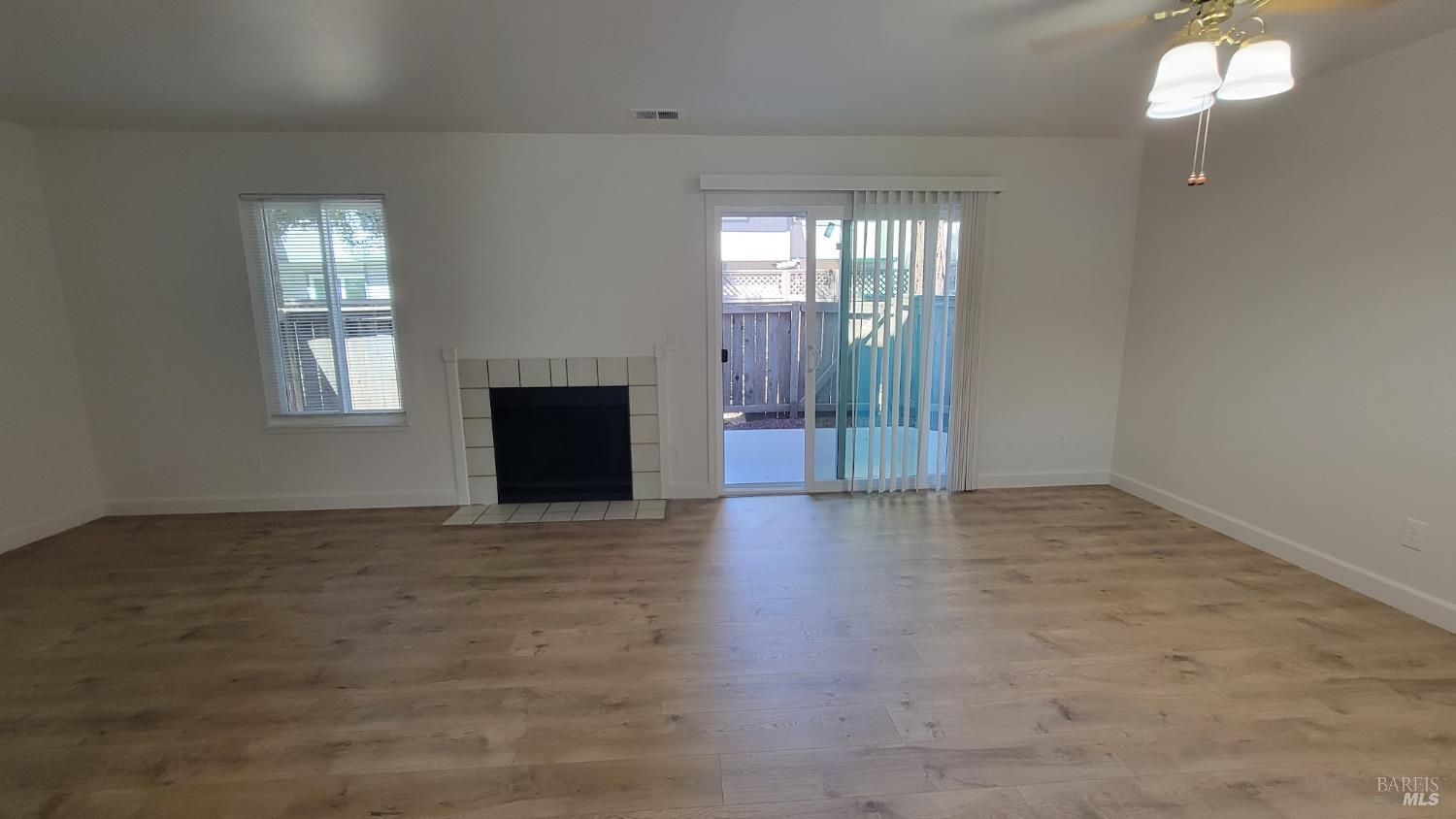 2305 Cross Avenue Santa Rosa, CA 95401 - Photo 11 of 35 an empty room with windows and fireplace