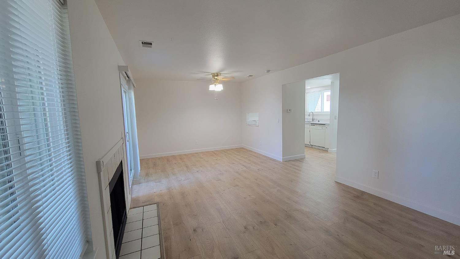 2305 Cross Avenue Santa Rosa, CA 95401 - Photo 13 of 35 a view of a livingroom with wooden floor and a ceiling fan