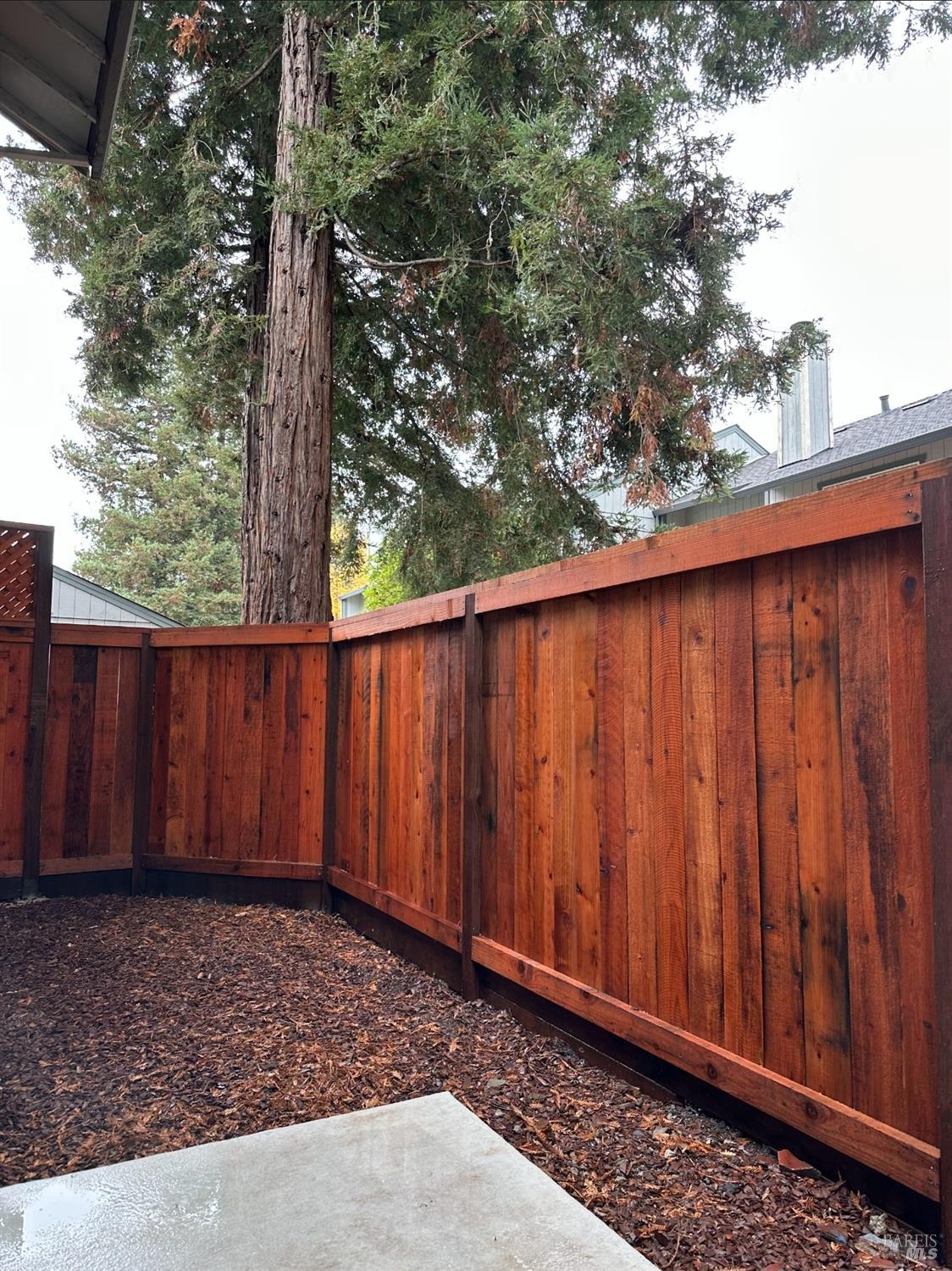 2305 Cross Avenue Santa Rosa, CA 95401 - Photo 16 of 35 a wooden fence with a trees in the background