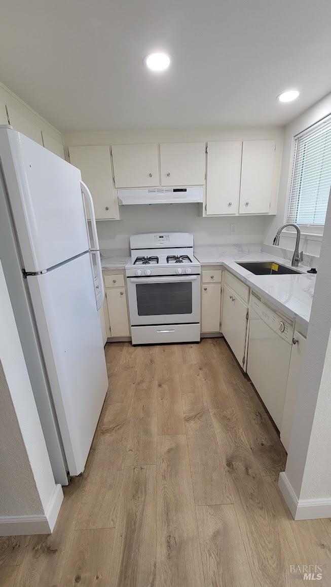 2305 Cross Avenue Santa Rosa, CA 95401 - Photo 5 of 35 a kitchen with a white cabinets and white appliances