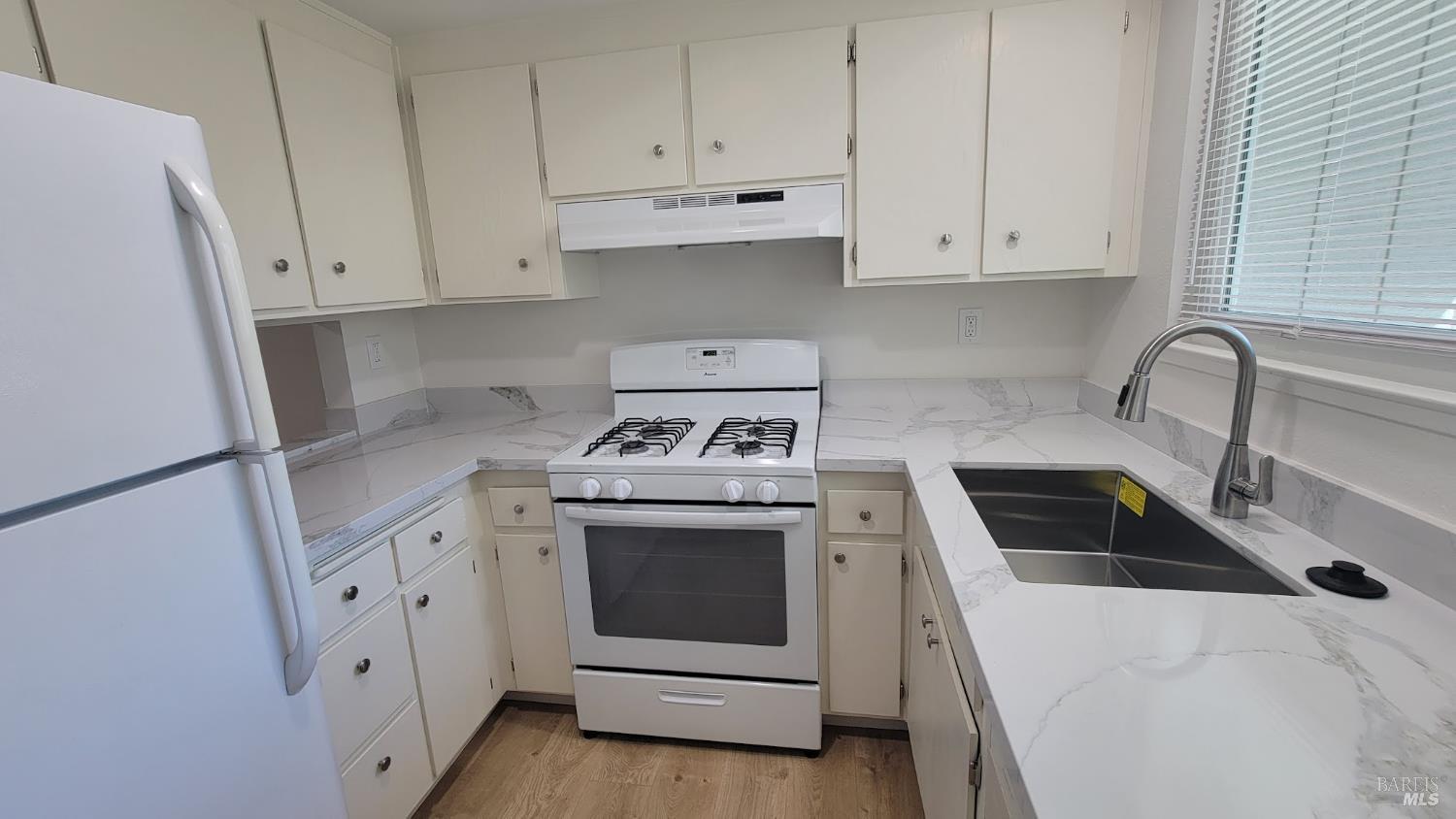 2305 Cross Avenue Santa Rosa, CA 95401 - Photo 7 of 35 a kitchen with white cabinets and white appliances