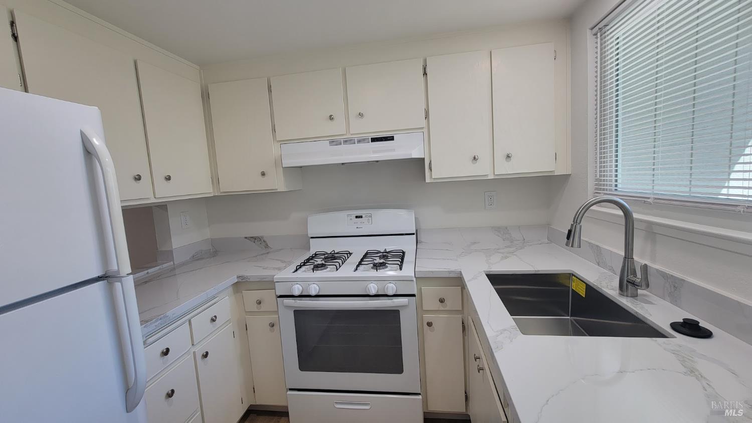 2305 Cross Avenue Santa Rosa, CA 95401 - Photo 8 of 35 a kitchen with white cabinets and white appliances