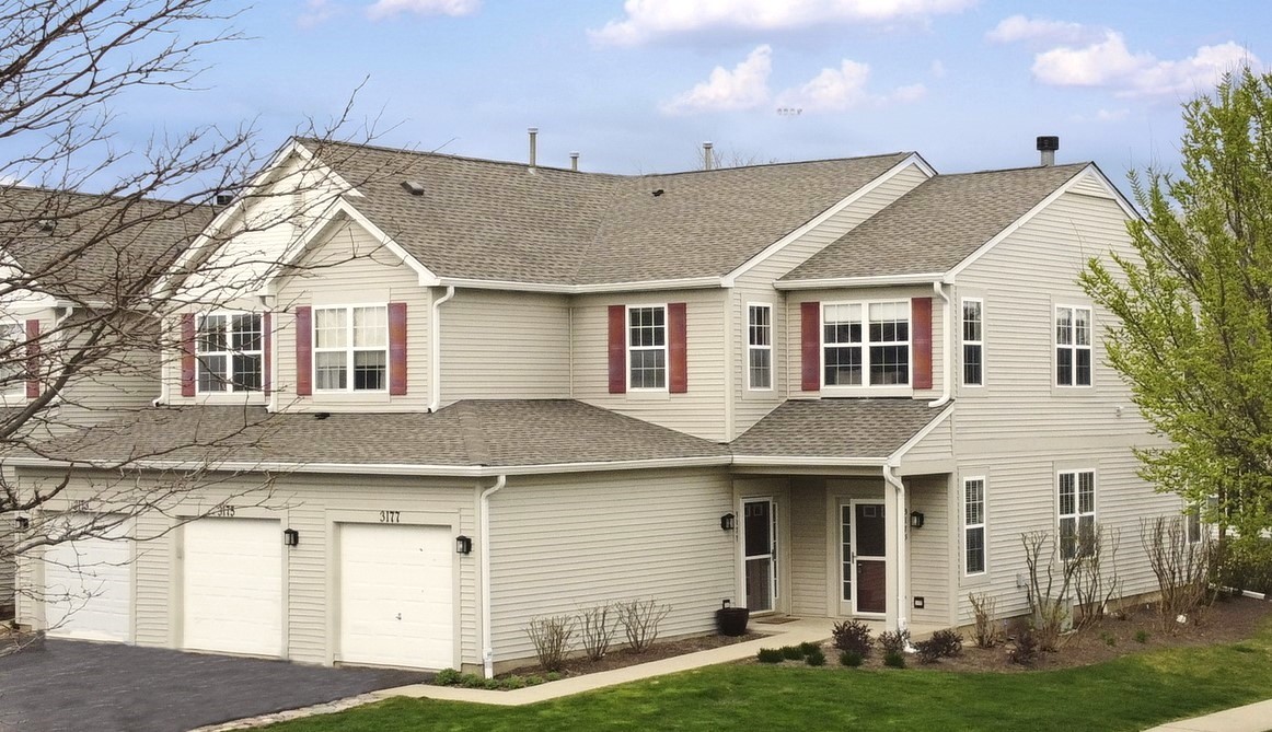 3175 Falling Waters Lane Lindenhurst, IL 60046 - Photo 1 of 19 a view of a yard in front of house