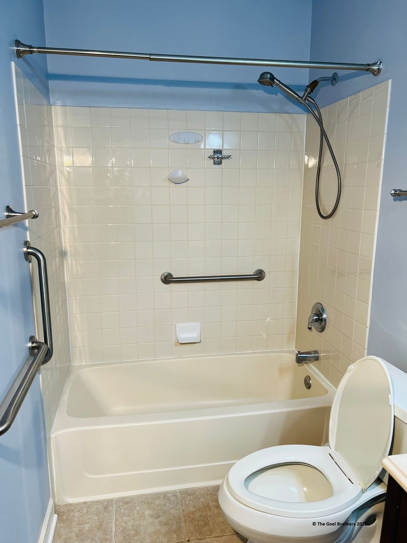 3175 Falling Waters Lane Lindenhurst, IL 60046 - Photo 14 of 19 a bathroom with a toilet bathtub and shower