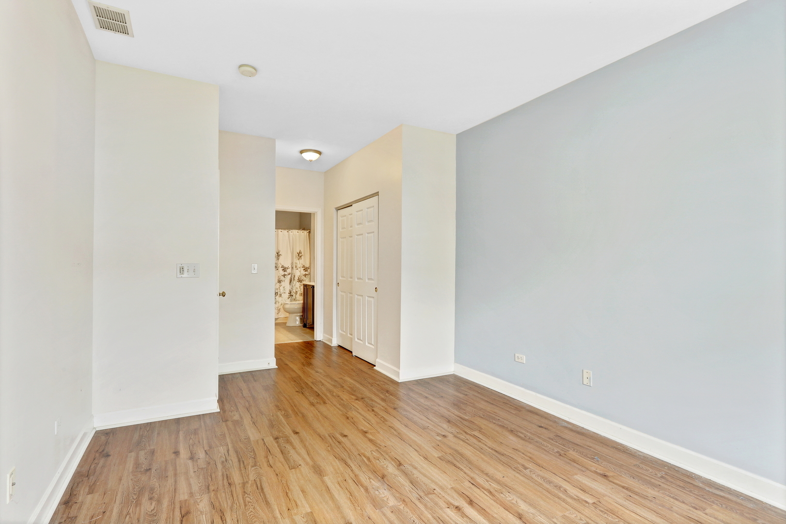 3175 Falling Waters Lane Lindenhurst, IL 60046 - Photo 15 of 19 a view of an empty room with wooden floor