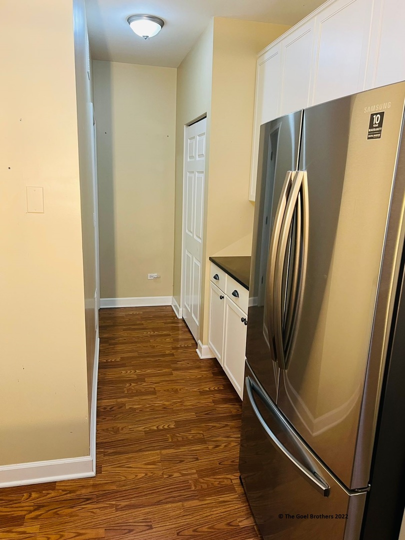 3175 Falling Waters Lane Lindenhurst, IL 60046 - Photo 9 of 19 a view of a hallway with wooden floor