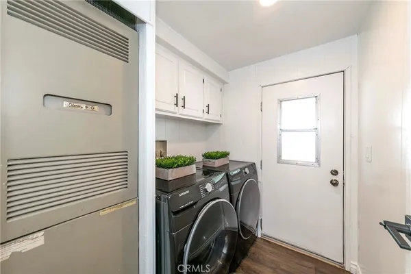a view of a storage & utility room with a sink