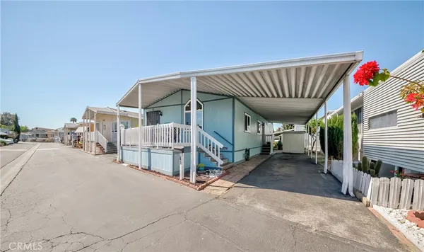 a view of a house with wooden stairs