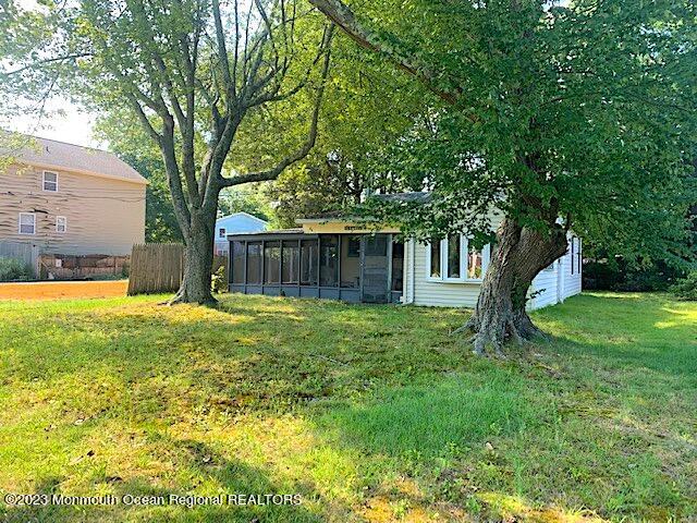 a view of a house with a backyard