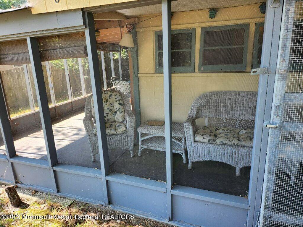 86 Dock Avenue Waretown, NJ 08758 - Photo 2 of 6 a bathroom with a glass shower door