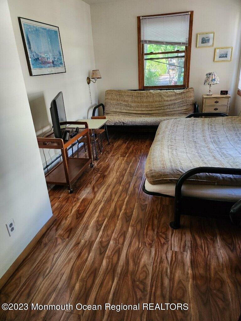 86 Dock Avenue Waretown, NJ 08758 - Photo 4 of 6 a living room with furniture and a wooden floor