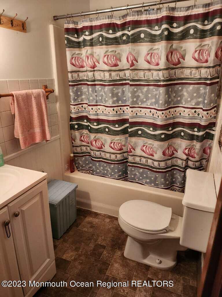 86 Dock Avenue Waretown, NJ 08758 - Photo 5 of 6 a bathroom with a toilet and a sink