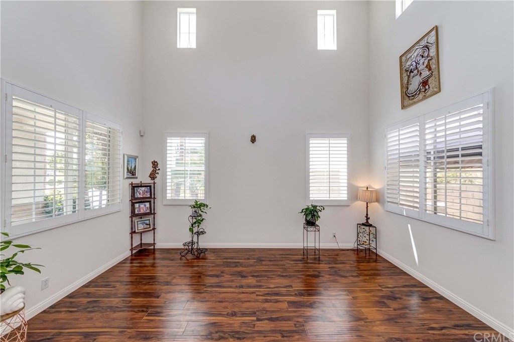 14007 Highlander Road La Mirada, CA 90638 - Photo 8 of 55 a view of empty room with wooden floor and fan