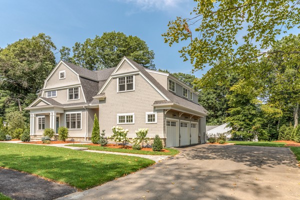 2 Winding Road Lexington, MA 02421 - Photo 2 of 28 a front view of a house with a garden