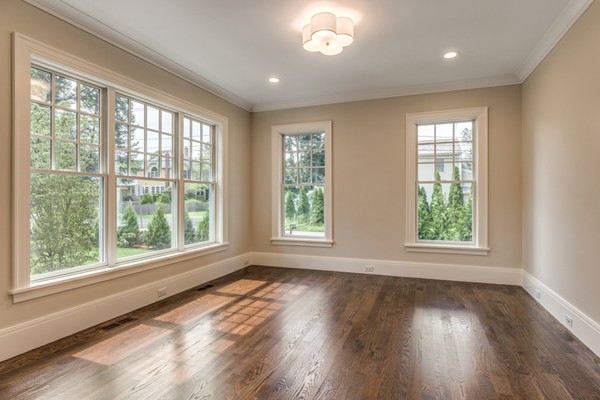 2 Winding Road Lexington, MA 02421 - Photo 6 of 28 a view of an empty room with wooden floor and a window