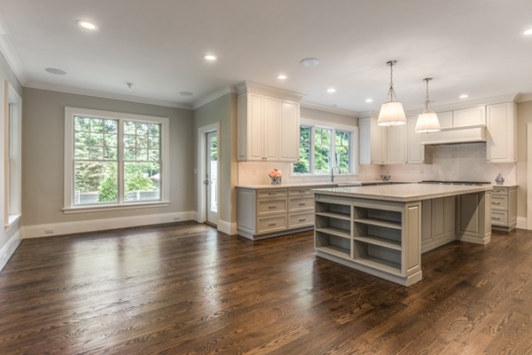 2 Winding Road Lexington, MA 02421 - Photo 8 of 28 a large kitchen with kitchen island a stove a sink a window and wooden floor