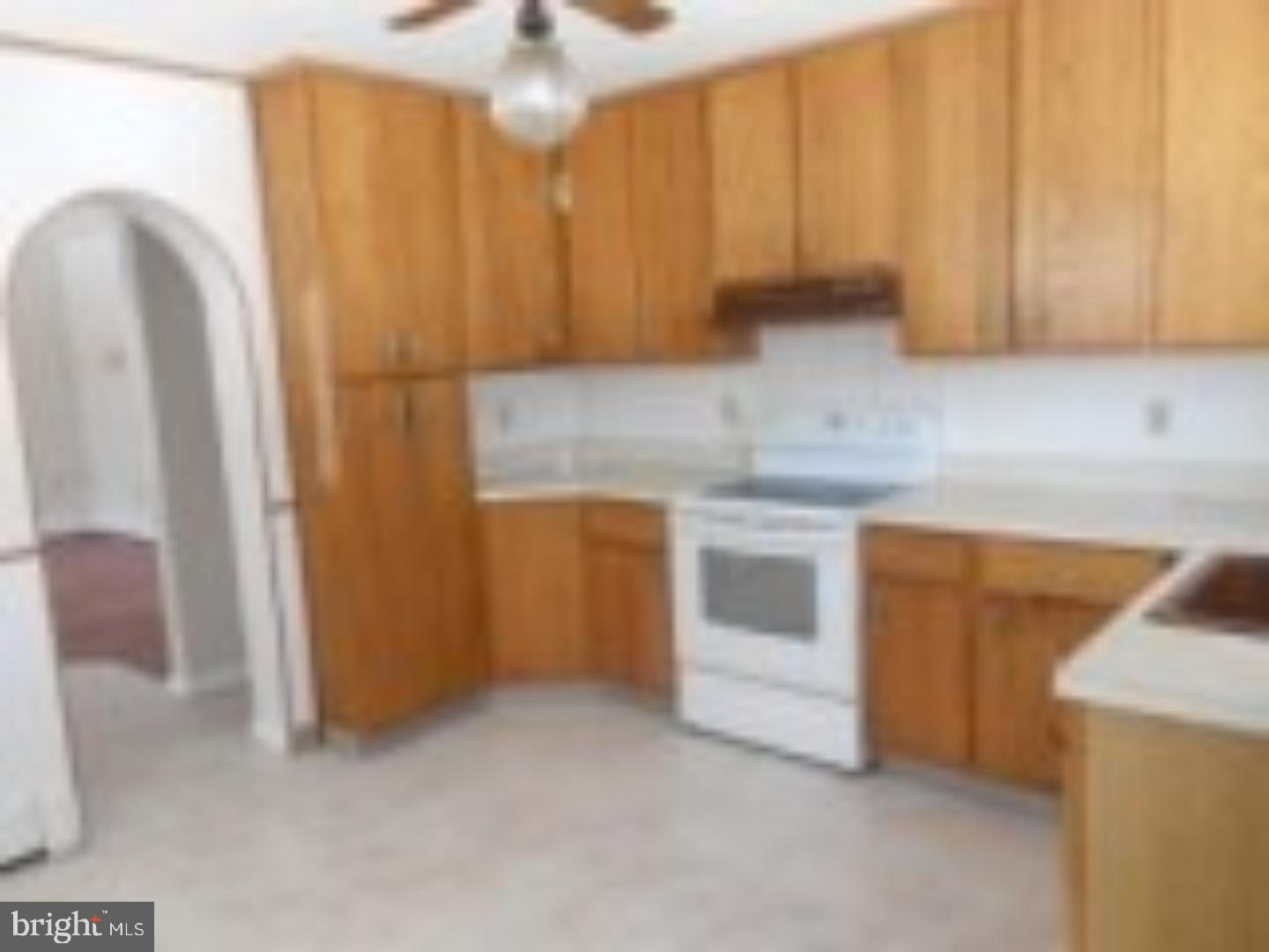 1031 Friedensburg Road Reading, PA 19606 - Photo 4 of 17 a kitchen with a refrigerator and a stove