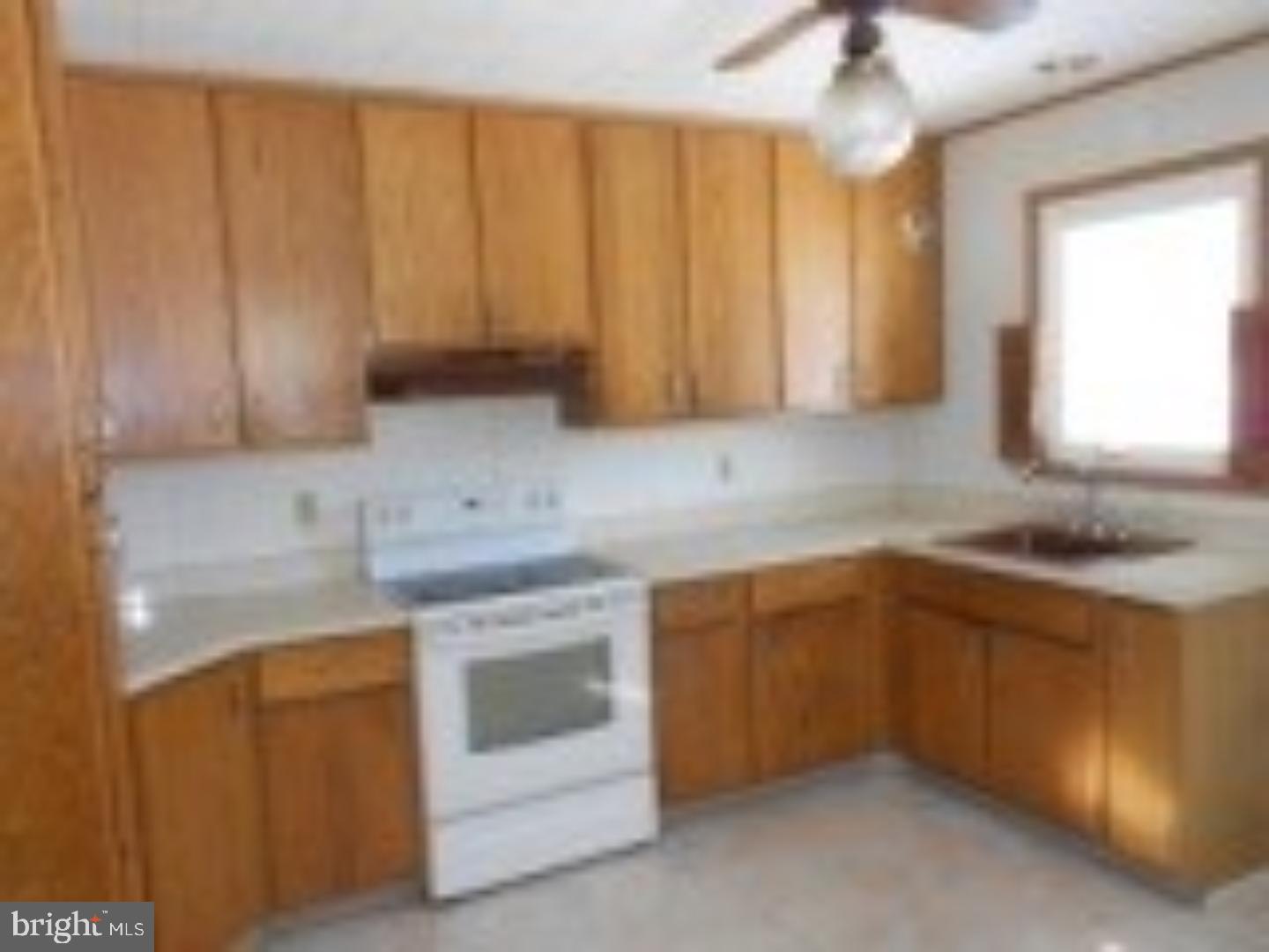 1031 Friedensburg Road Reading, PA 19606 - Photo 5 of 17 a kitchen with a sink cabinets and window