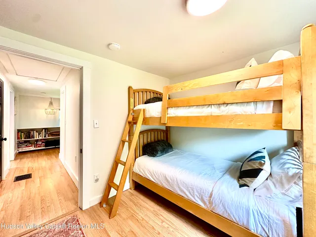 a bedroom with a bed and a view of walk in closet