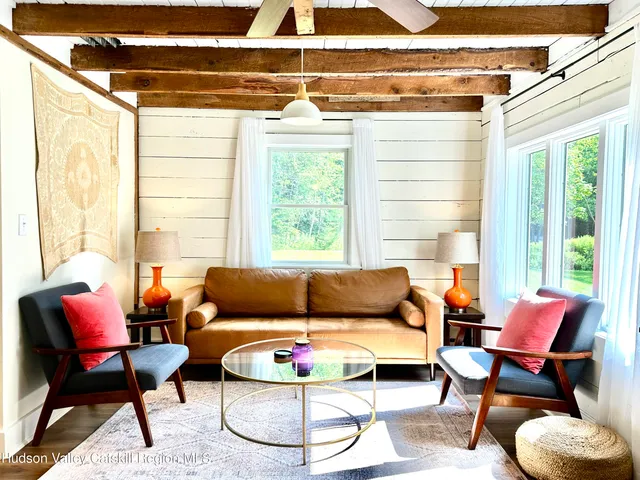 a living room with furniture and a window