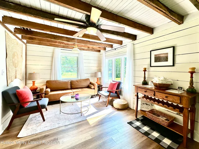 a bedroom with furniture and a window