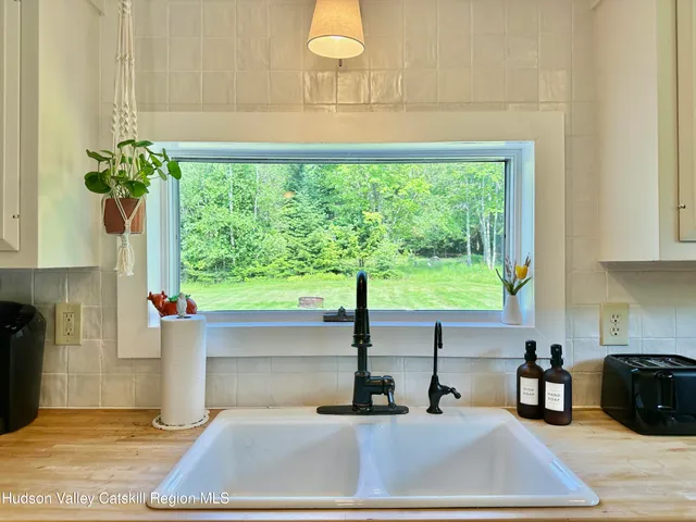 a kitchen with a sink and a window