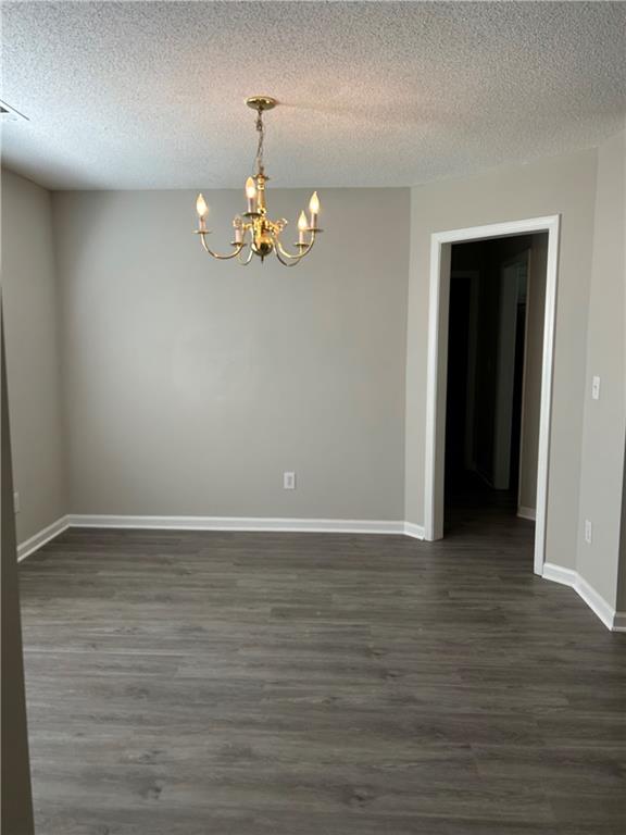 1140 Katie Lynne Lane Dacula, GA 30019 - Photo 5 of 6 a view of an empty room with wooden floor