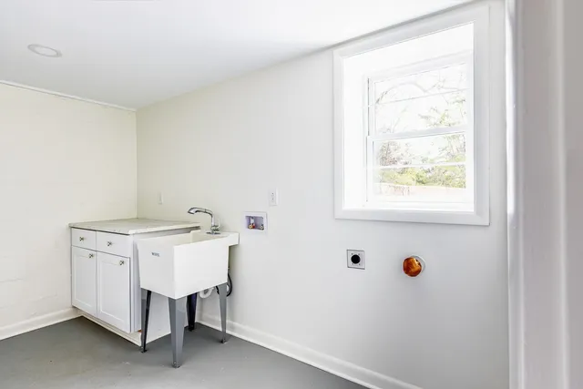 a bathroom with a sink and a window