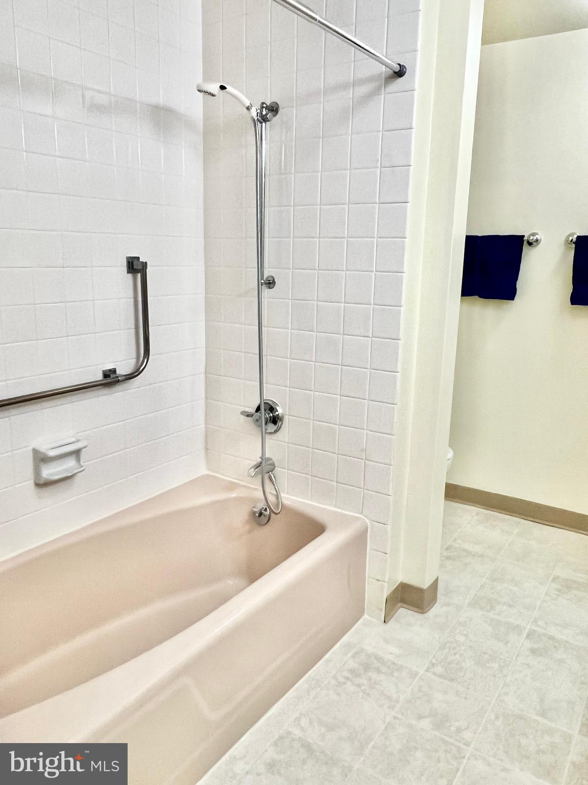 3386 Chiswick Court, Unit 501A Silver Spring, MD 20906 - Photo 14 of 43 a spacious bathroom with a bathtub and shower