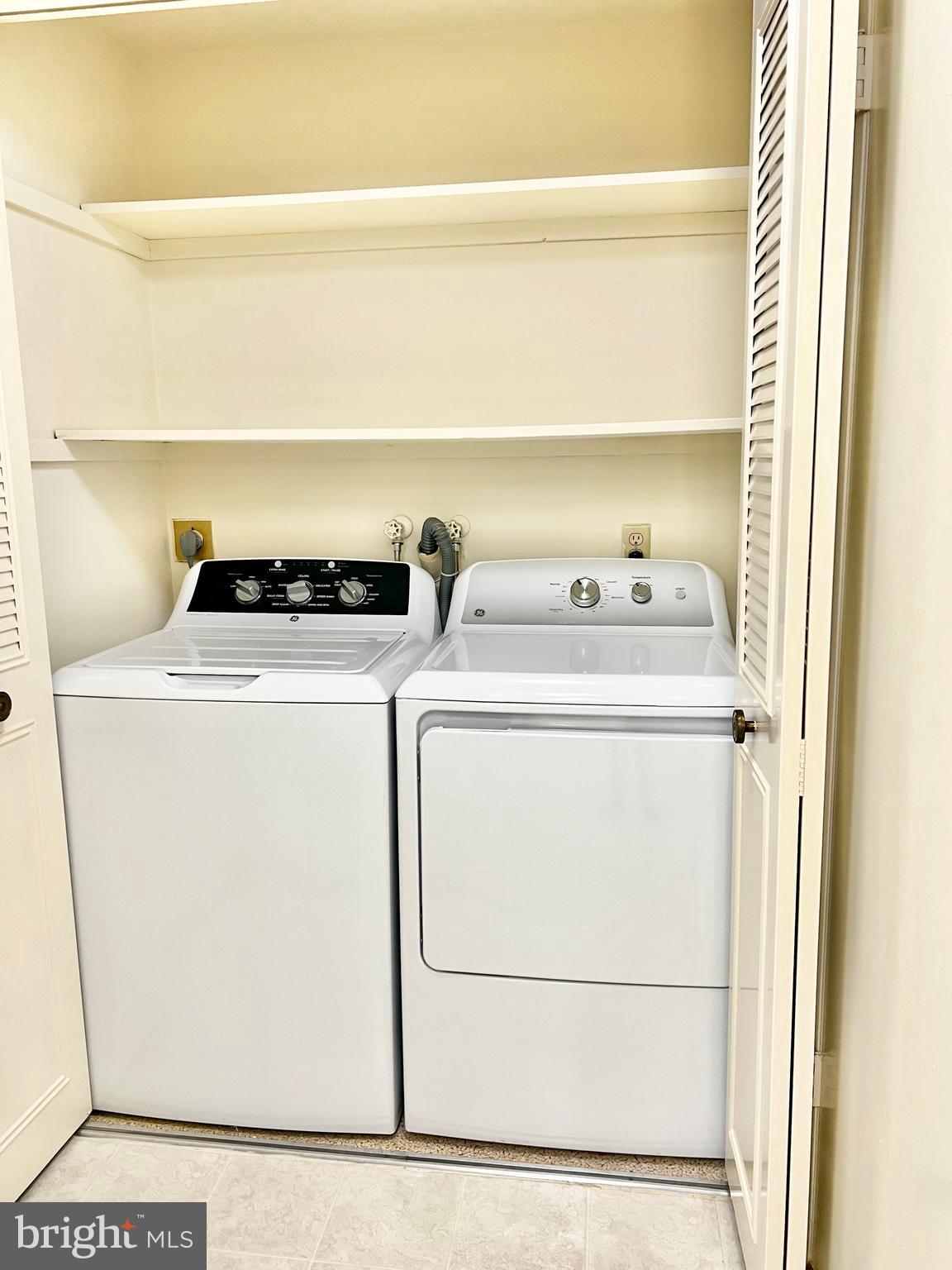 3386 Chiswick Court, Unit 501A Silver Spring, MD 20906 - Photo 15 of 43 a utility room with dryer and washer