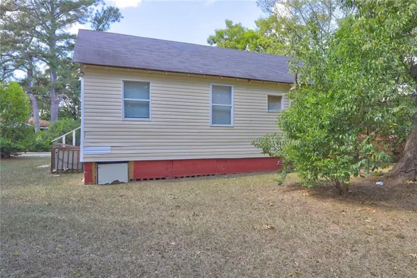 a view of a house with a yard and an outdoor space