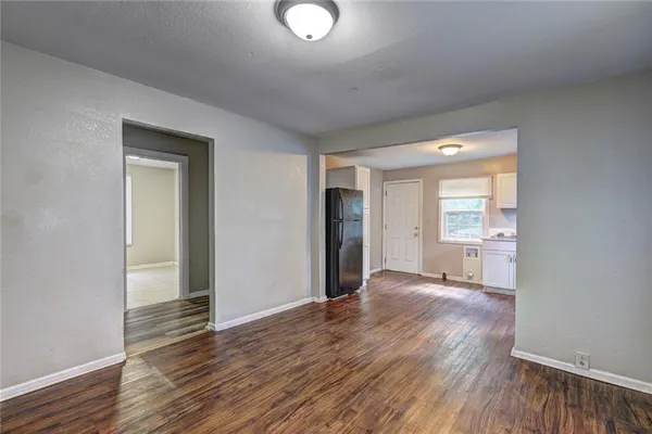 wooden floor in an empty room and a window