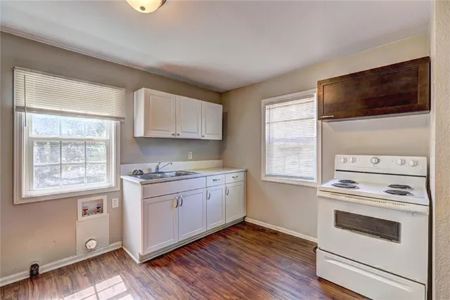 a kitchen with a stove and a microwave