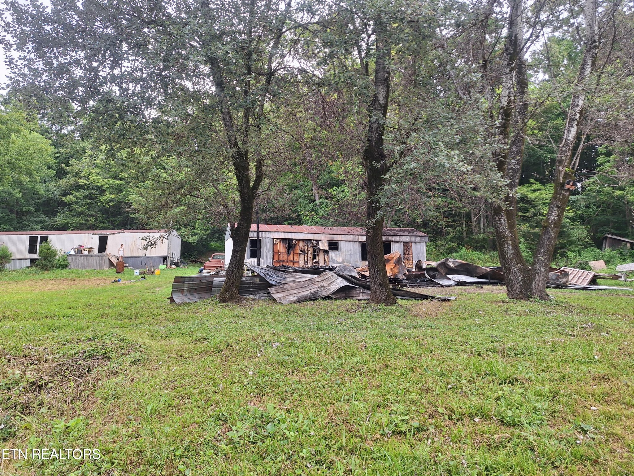401 Rudd Hollow Road Townsend, TN 37882 - Photo 1 of 3 a view of a house with garden and trees